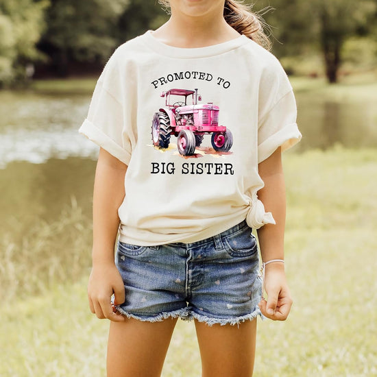 Pink promoted to big sister shirt styled on model with farm background