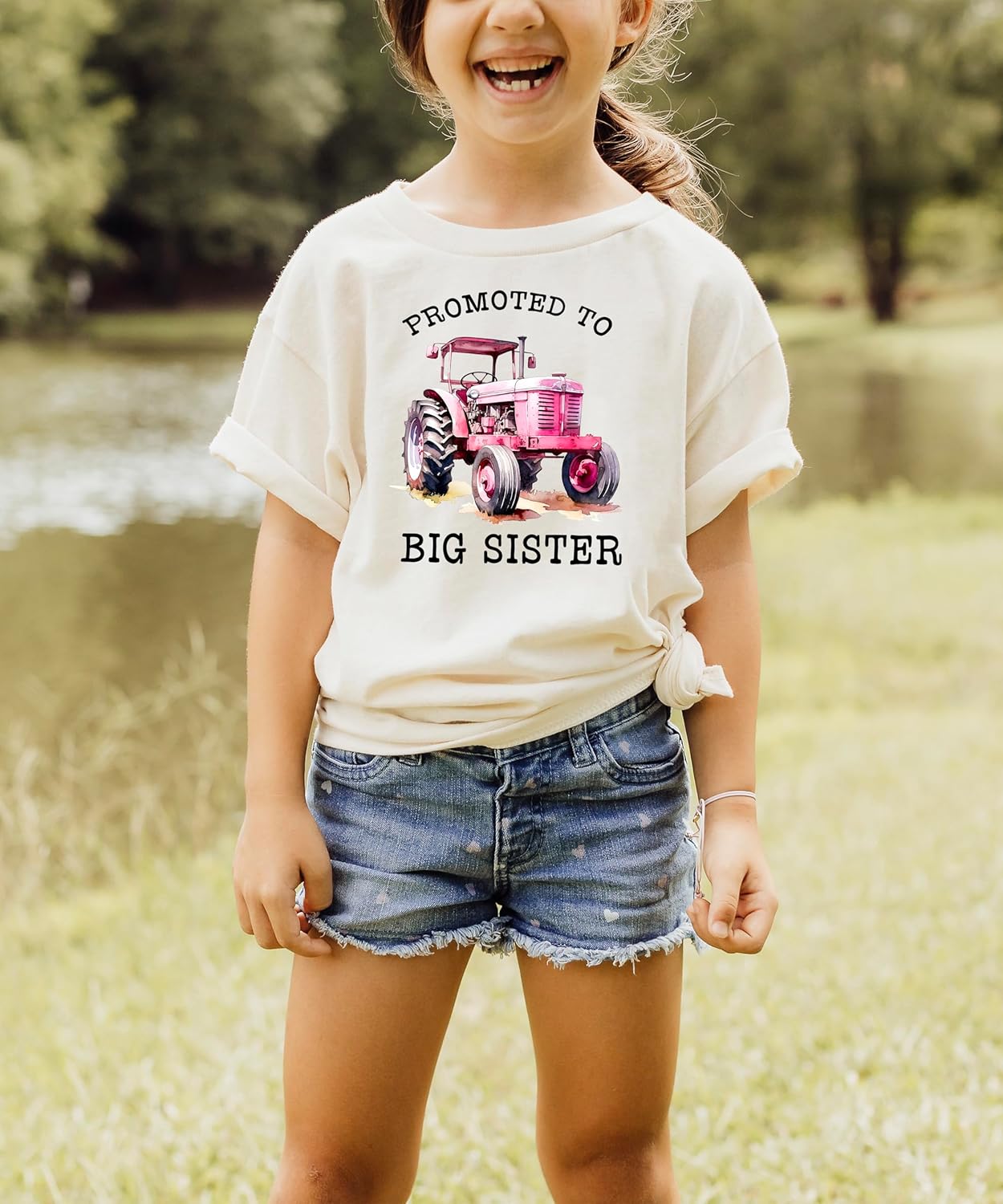 Pink promoted to big sister shirt styled on model with farm background