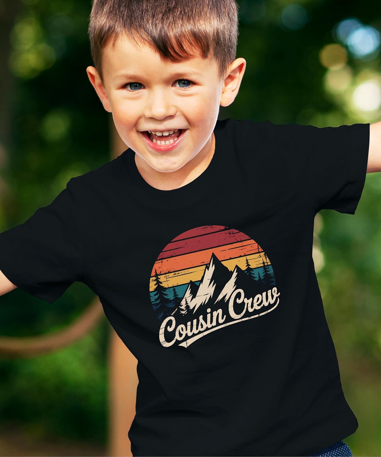 Family wearing matching black Cousin Crew mountain shirts in various sizes