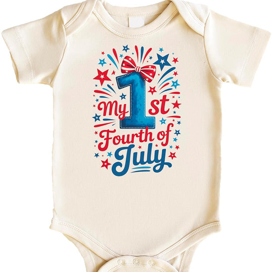 Close-up view of patriotic baby bodysuit showing detailed stars, stripes and hand-lettered script graphics