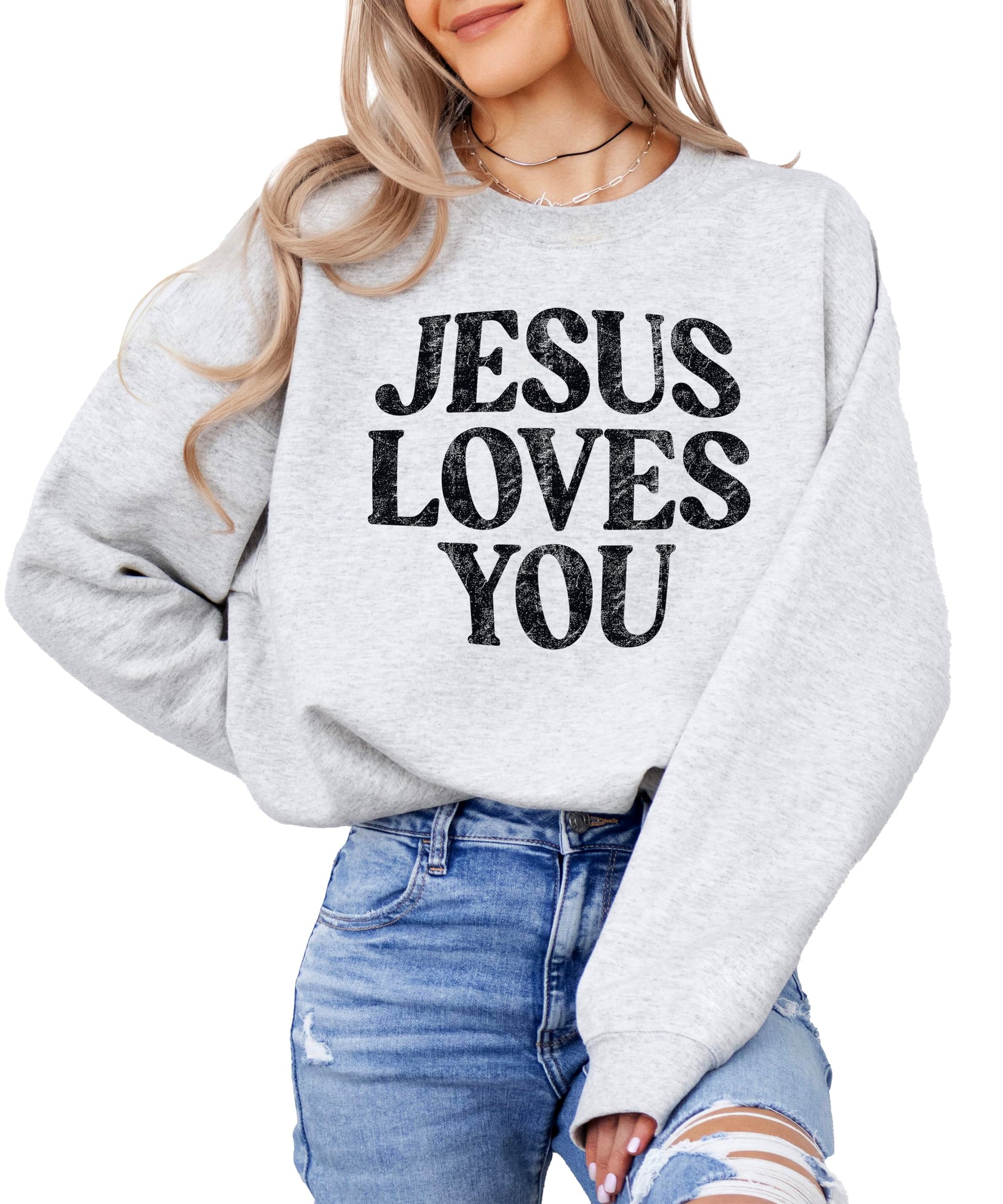 Close-up of Jesus Loves You distressed text design on sweatshirt