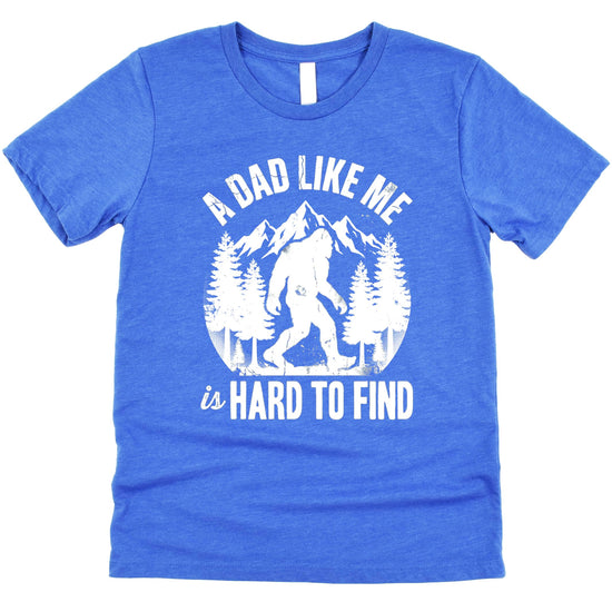 Military green dad shirt featuring funny Sasquatch graphic with pine trees and mountains