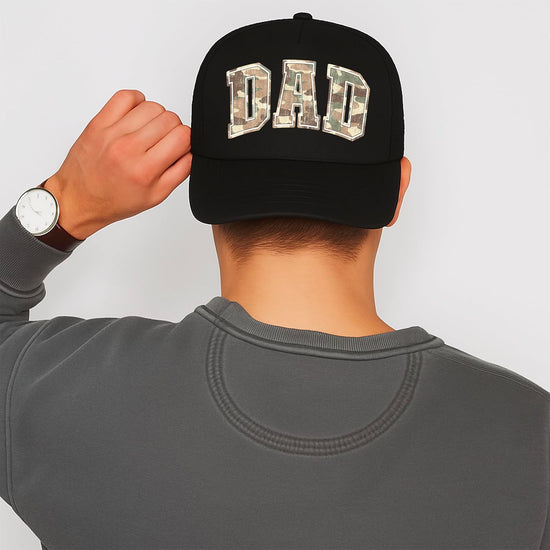 Side view of dad camo trucker hat displaying curved bill and snapback closure