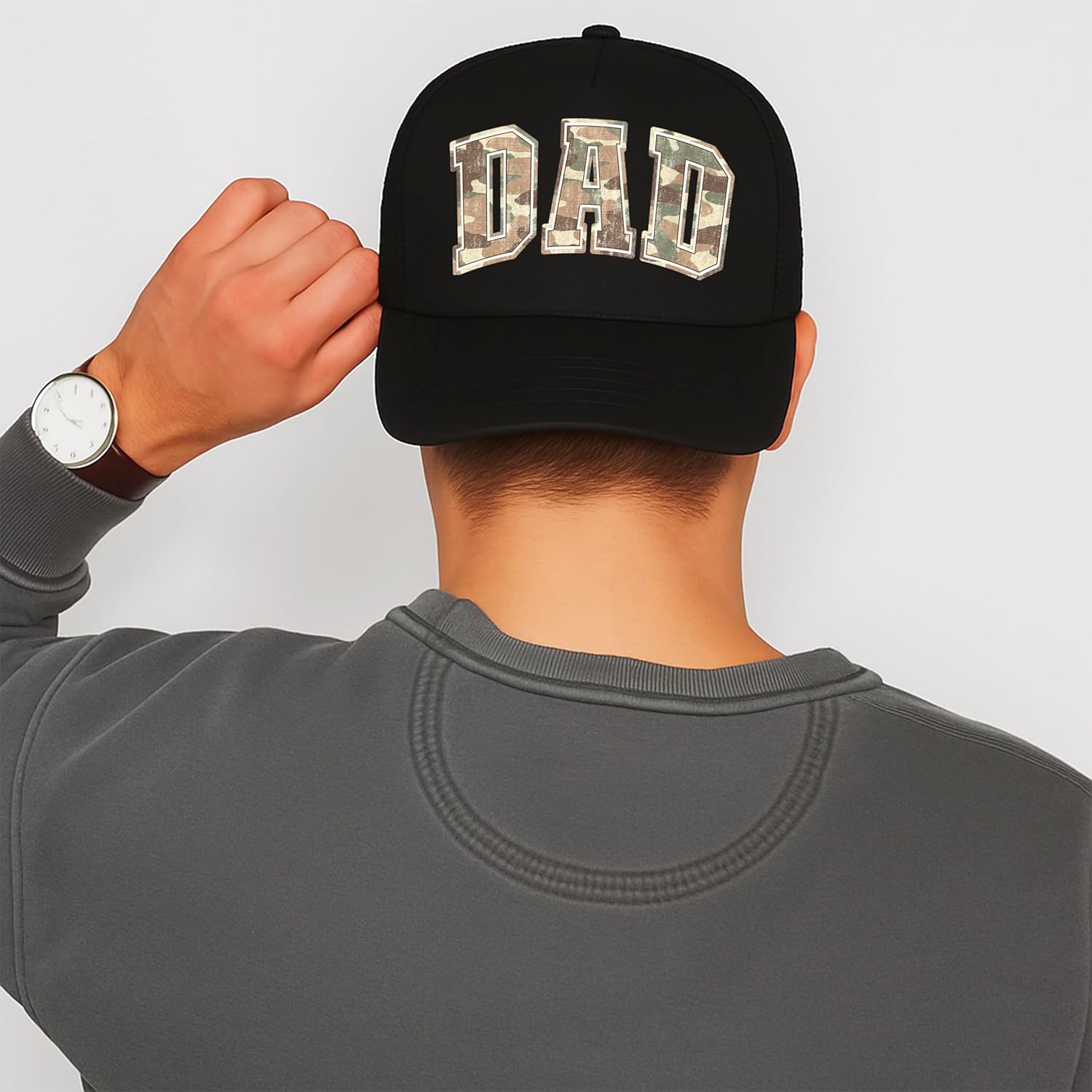 Side view of dad camo trucker hat displaying curved bill and snapback closure