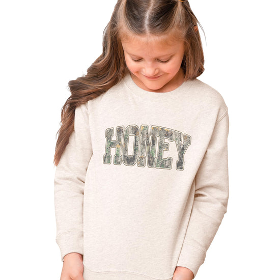 Detail shot of Honey Camo sweatshirt fabric and print quality