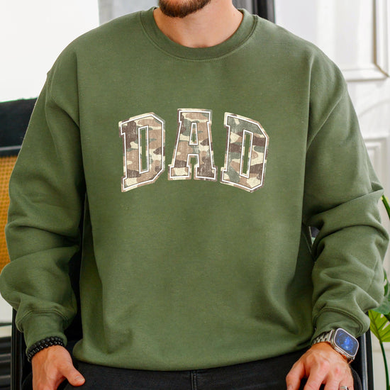 Flat lay of camo dad hunting sweatshirt showing overall design