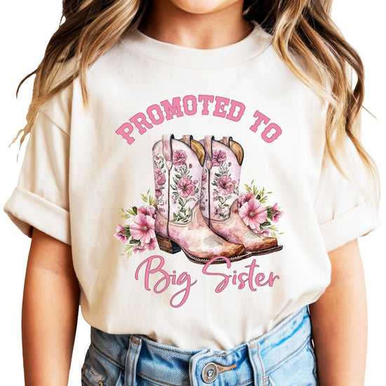 Pink Promoted to Big Sister shirt with cowgirl boots and floral design for girls