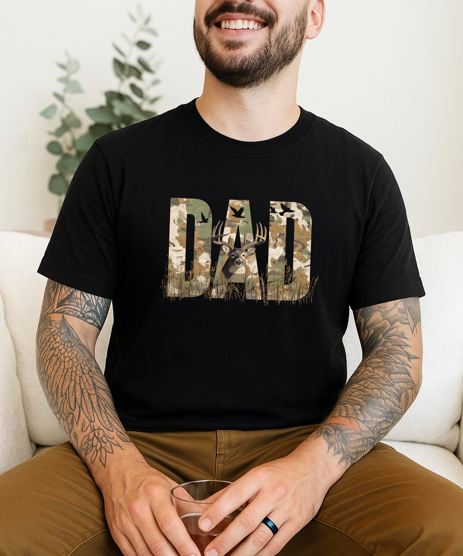 Side angle view of men's hunting graphic tee with camo text and deer artwork