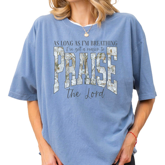 Women's blue jean colored Christian Easter t-shirt with As Long As I'm Breathing I've Got a Reason to Praise text