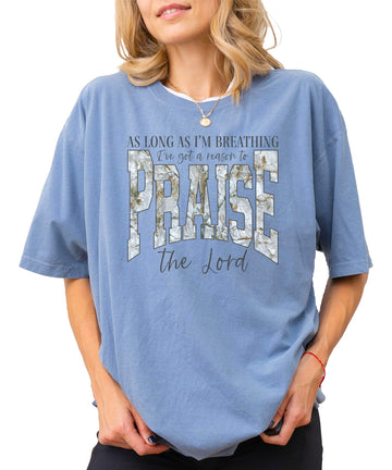 Women's blue jean colored Christian Easter t-shirt with As Long As I'm Breathing I've Got a Reason to Praise text