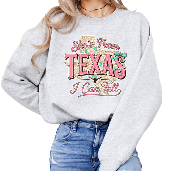 Model wearing army green Texas cowgirl sweatshirt demonstrating fit and style
