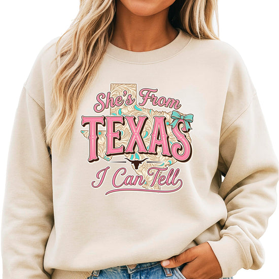 Close-up detail of She's From Texas western graphic print on army green sweatshirt