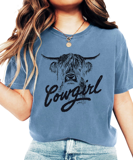 Highland cow cowgirl shirt in blue with rustic western design and trendy script text