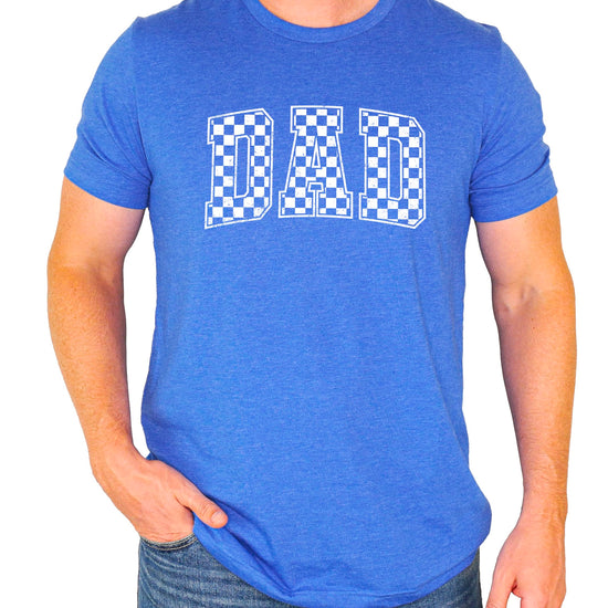 Full front view of man wearing black checkered DAD graphic tee shirt