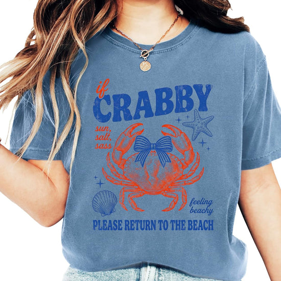 If Crabby Please Return to the Beach ivory shirt with vintage crab bow design flat lay