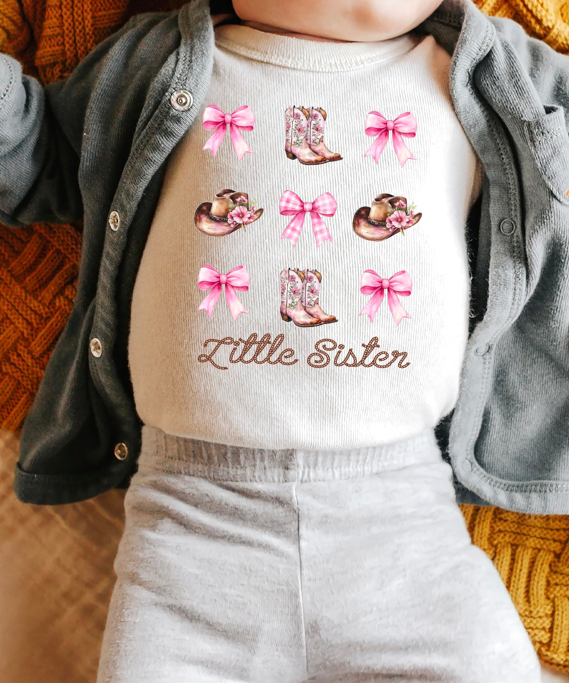 Side view of pink Little Sister baby bodysuit showing comfortable fit and snap closure