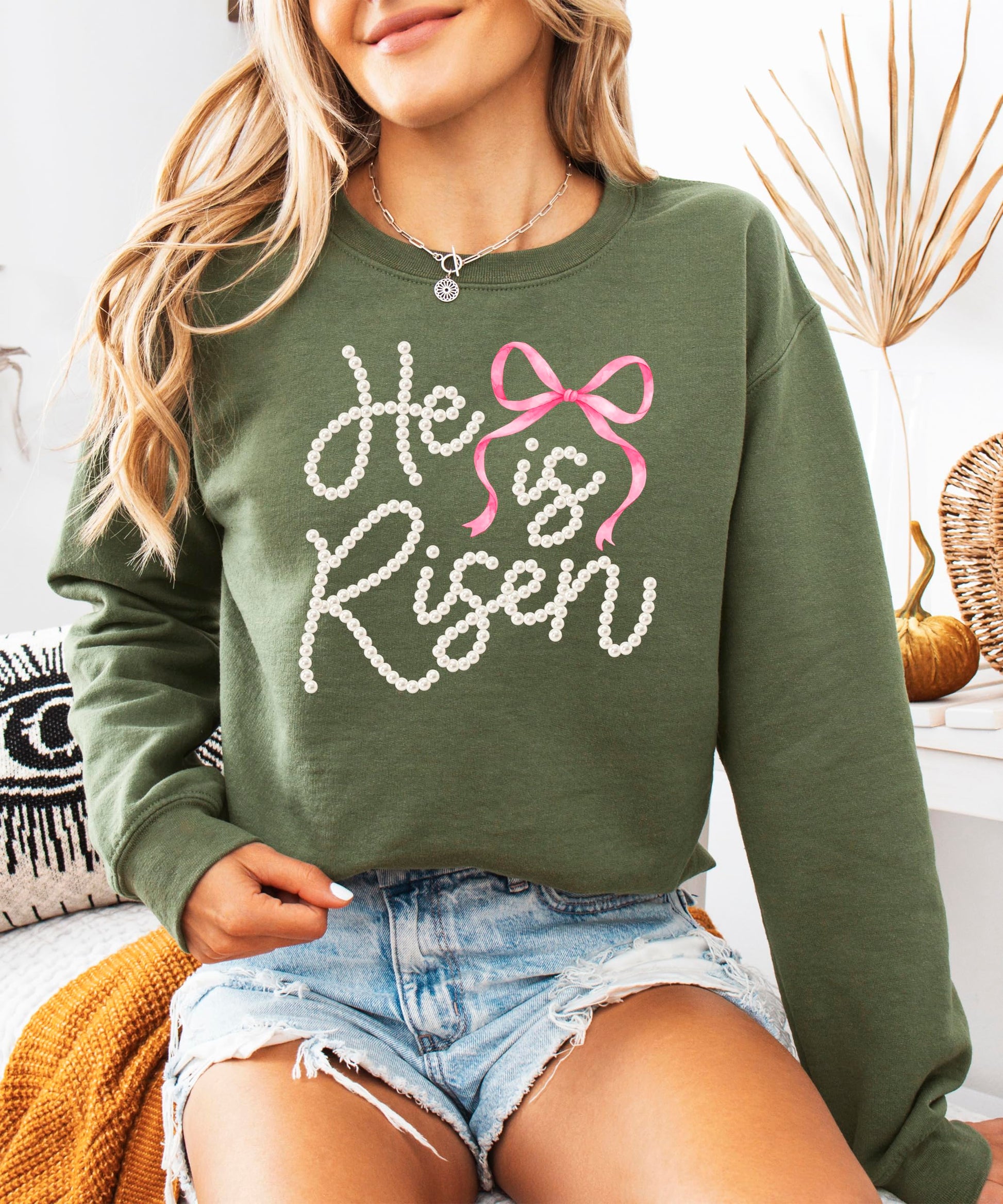 Side angle of women's Christian faith sweatshirt with pearl bow Easter design