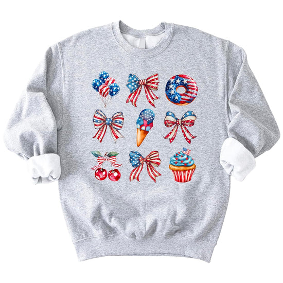Close-up of patriotic sweatshirt design showing watercolor bows balloons flag donut ice cream and 4th of July treats