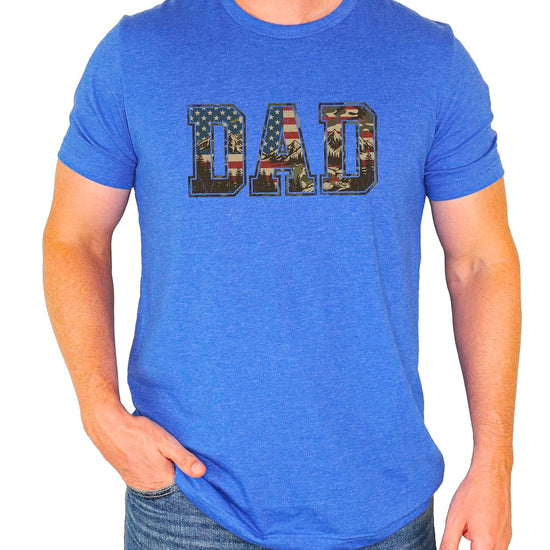 Man wearing natural patriotic DAD shirt with mountain camo American flag graphic