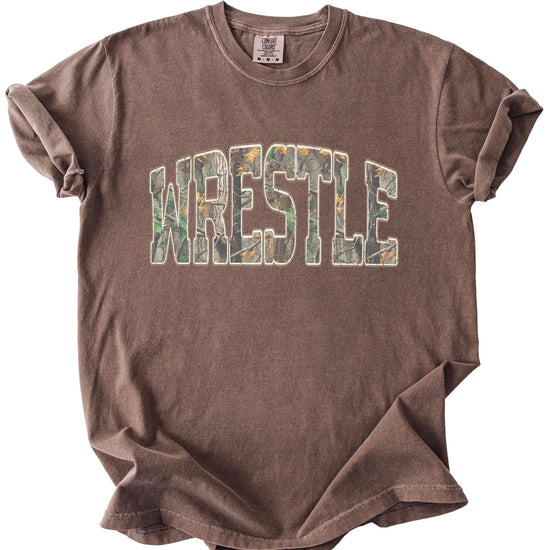 Close-up view of camo wrestling shirt showing detailed graphic print quality