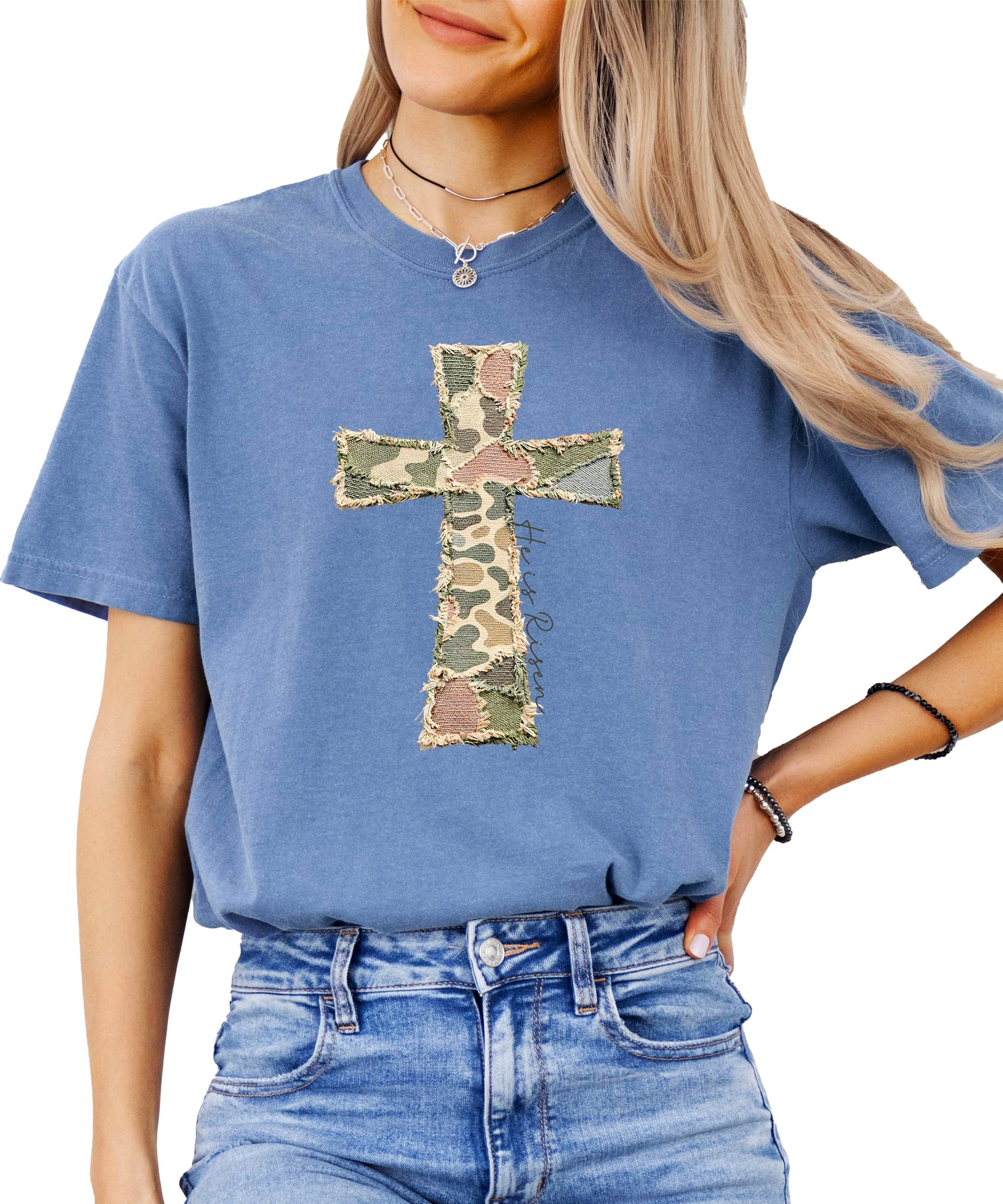 Flat lay of blue Christian Easter shirt with cross graphic design