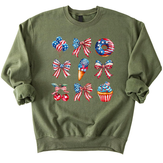 White crewneck sweatshirt with patriotic red white blue watercolor design featuring bows balloons treats and sparkler cupcake