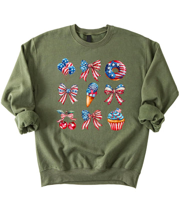 White crewneck sweatshirt with patriotic red white blue watercolor design featuring bows balloons treats and sparkler cupcake