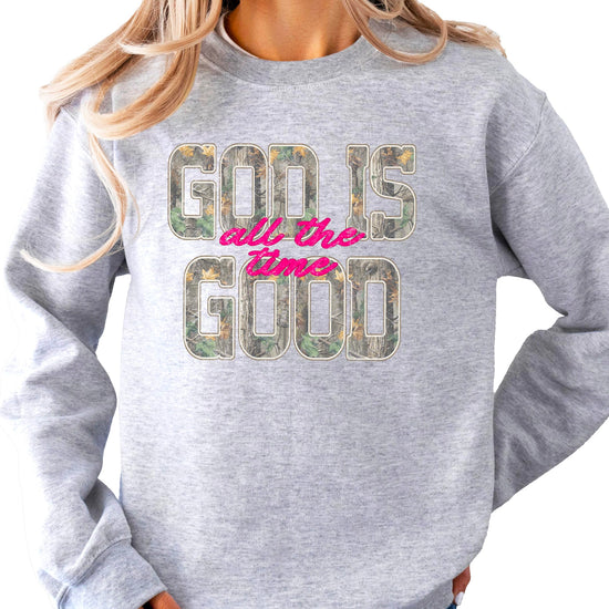 Women's camo pullover sweatshirt product styled on model