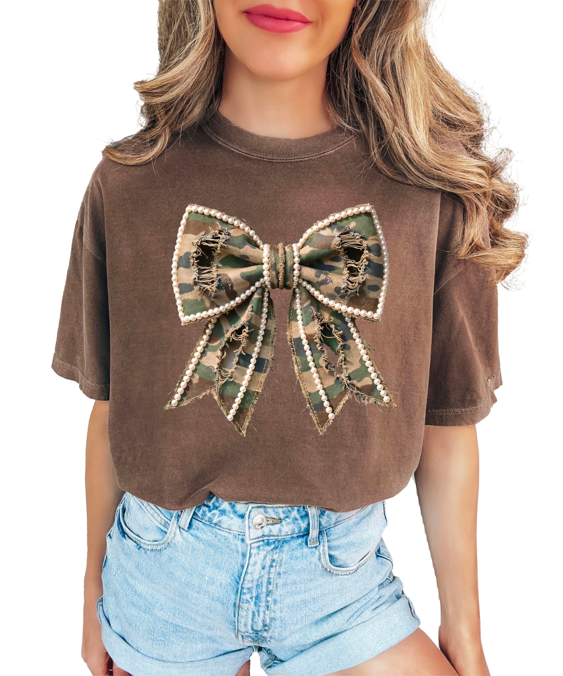 Close-up view of camo and pearls bow graphic design on women's shirt