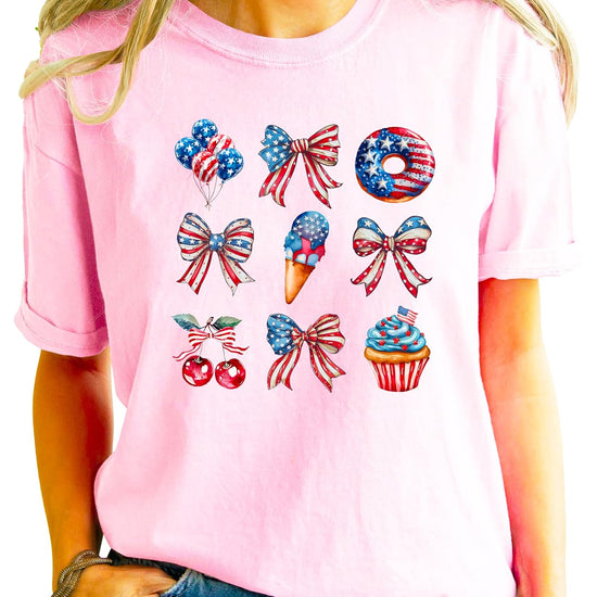 Pink 4th of July shirt styled with denim shorts showing comfortable fit and patriotic bow graphics