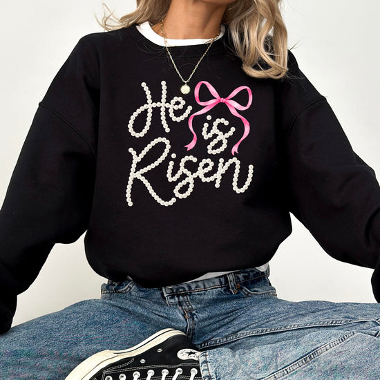 Detailed shot of pearl lettering and bow embellishment on Easter themed pullover