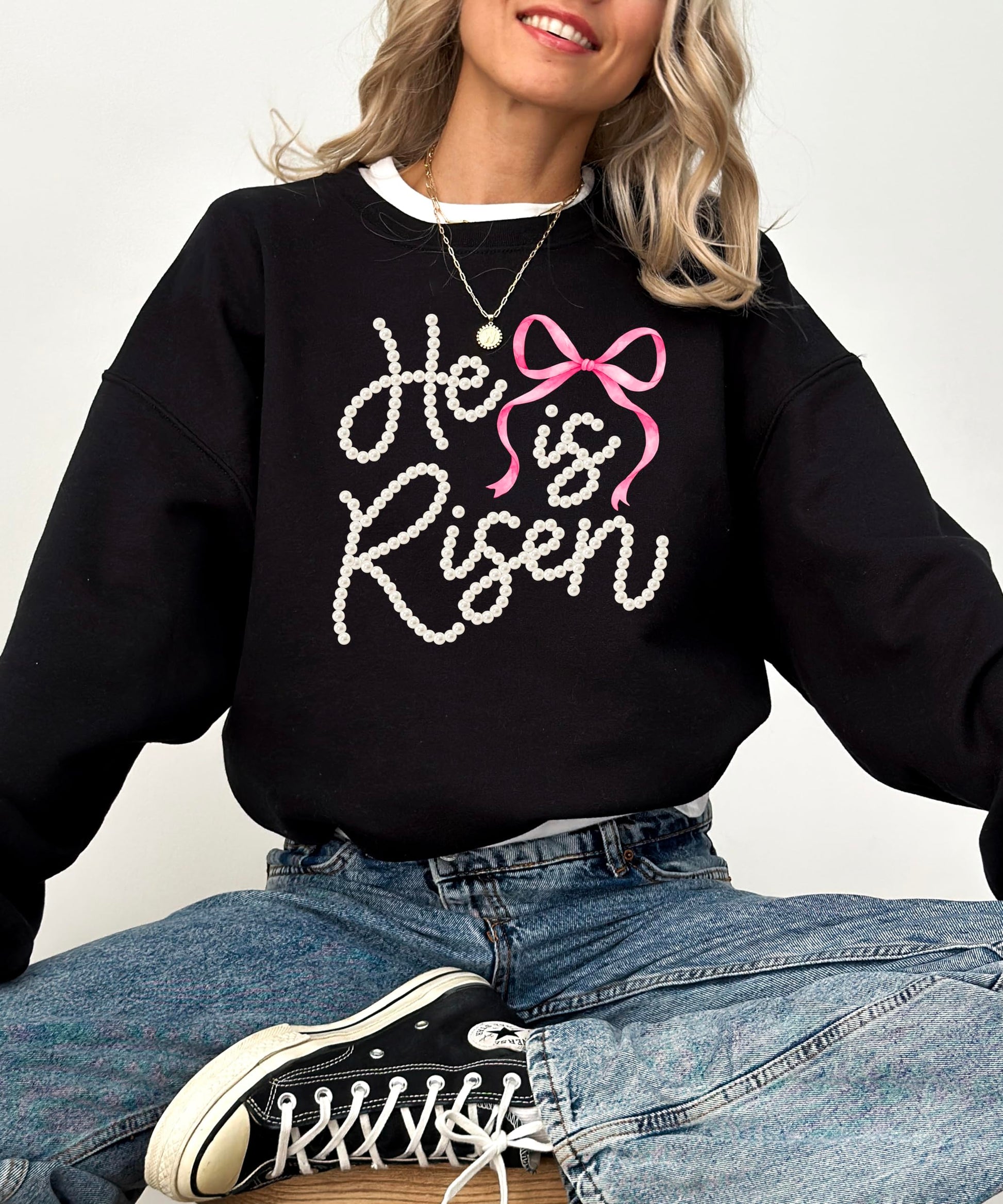 Detailed shot of pearl lettering and bow embellishment on Easter themed pullover