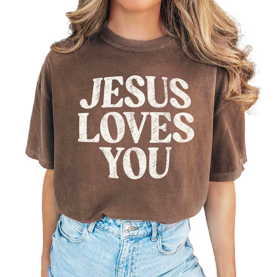 Woman wearing Jesus Loves You Christian faith shirt in casual blue jean shade