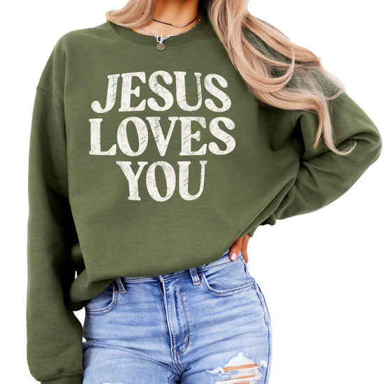 Jesus Loves You sweatshirt flat lay showing distressed graphic design detail