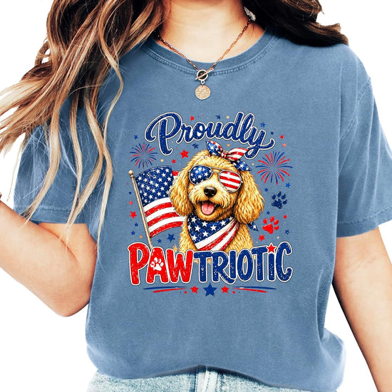 Flat lay of Proudly Pawtriotic doodle dog 4th of July women's graphic tee showing full design