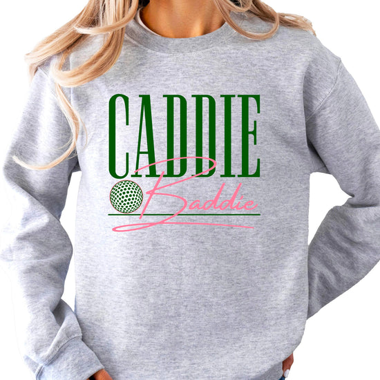 Flat lay of Caddie Baddie golf sweatshirt showing design and fit