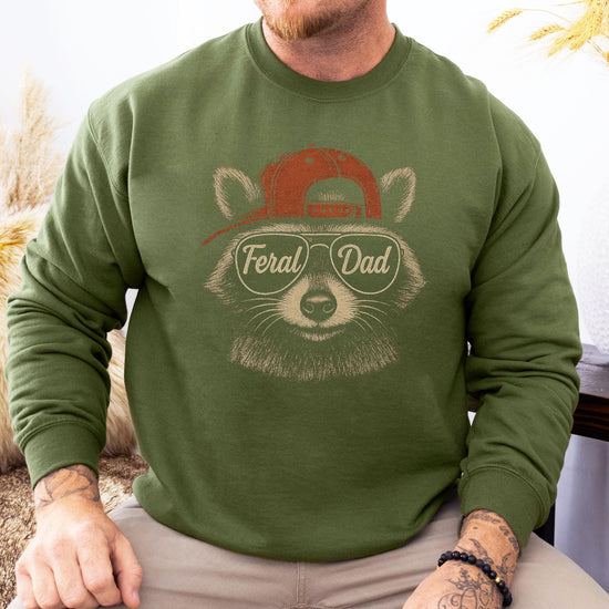 Feral Dad graphic sweatshirt showing raccoon mascot design on black fabric