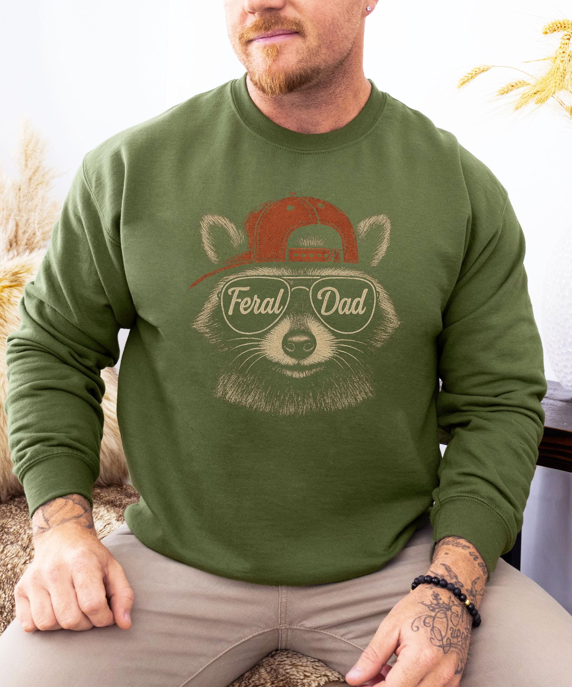 Feral Dad graphic sweatshirt showing raccoon mascot design on black fabric