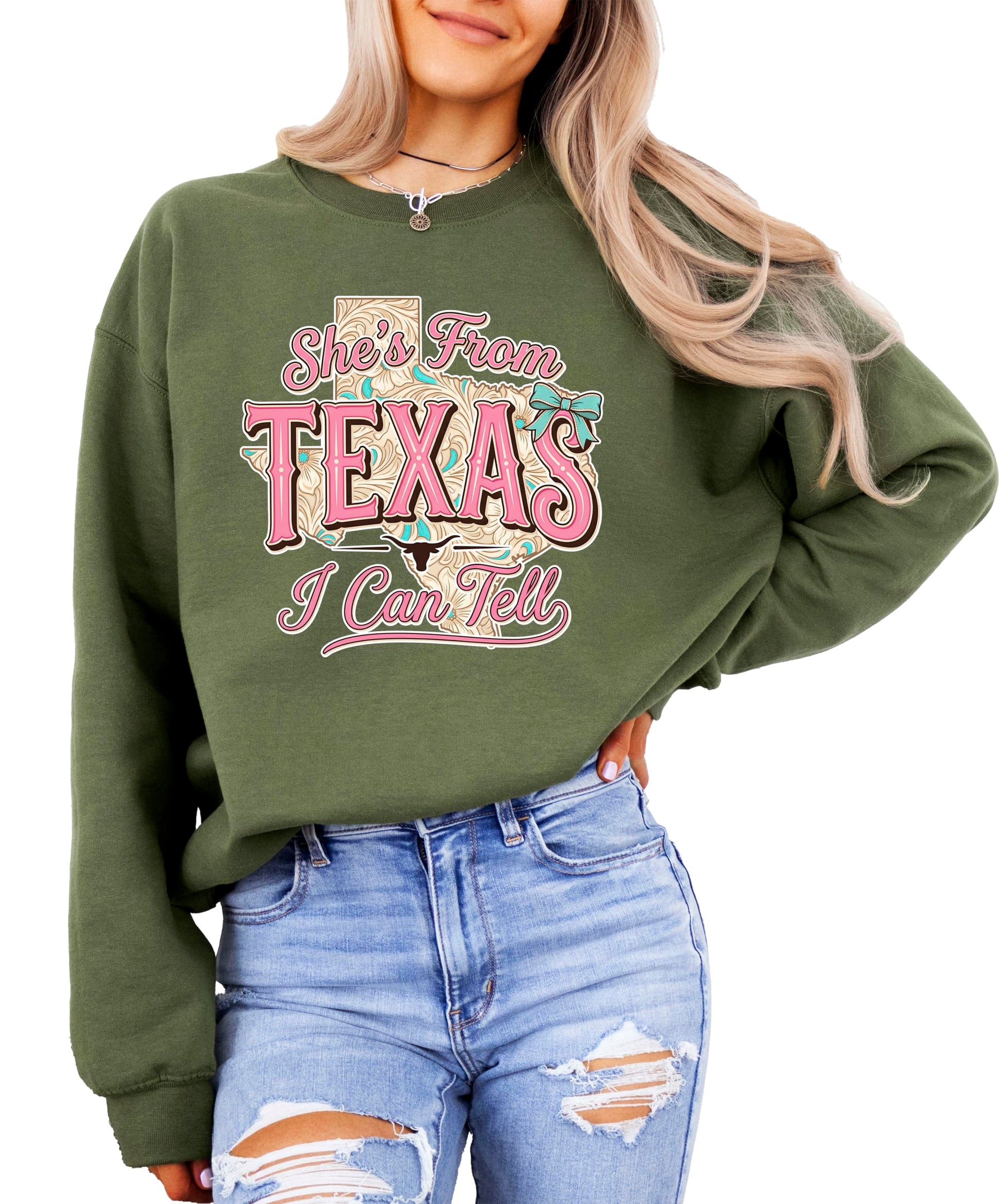 Flat lay of She's From Texas sweatshirt showing full design and western typography