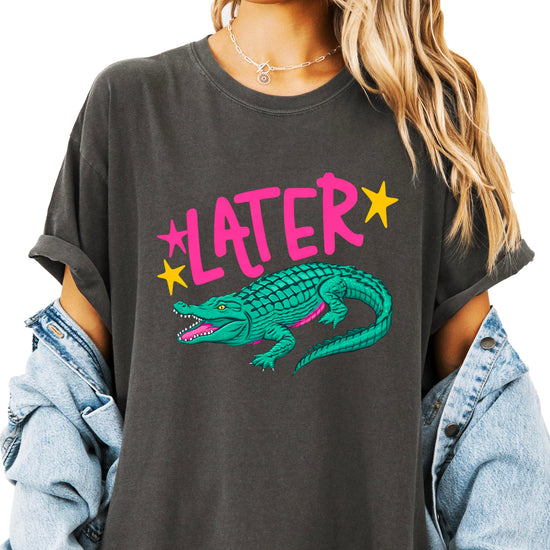 Women's crocodile humor tee flat lay showing front Later Gator design