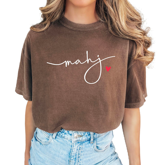 Model wearing mahj script shirt styled with jeans for casual mahjong game day look