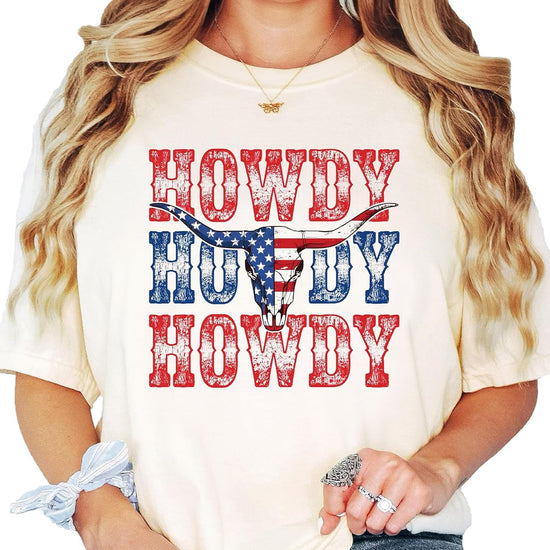 Lifestyle shot of person wearing Howdy American flag bull skull Western graphic tee