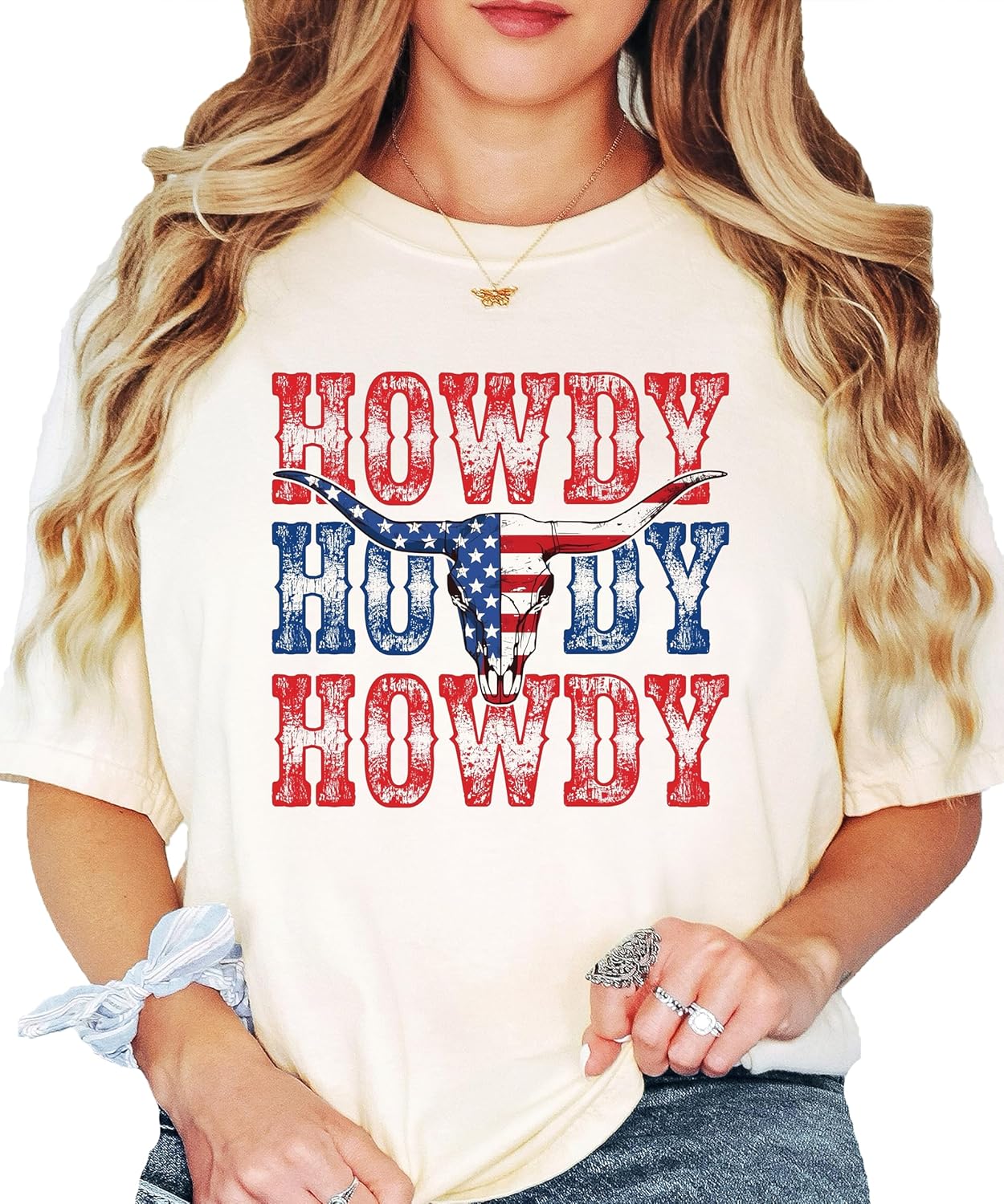 Lifestyle shot of person wearing Howdy American flag bull skull Western graphic tee