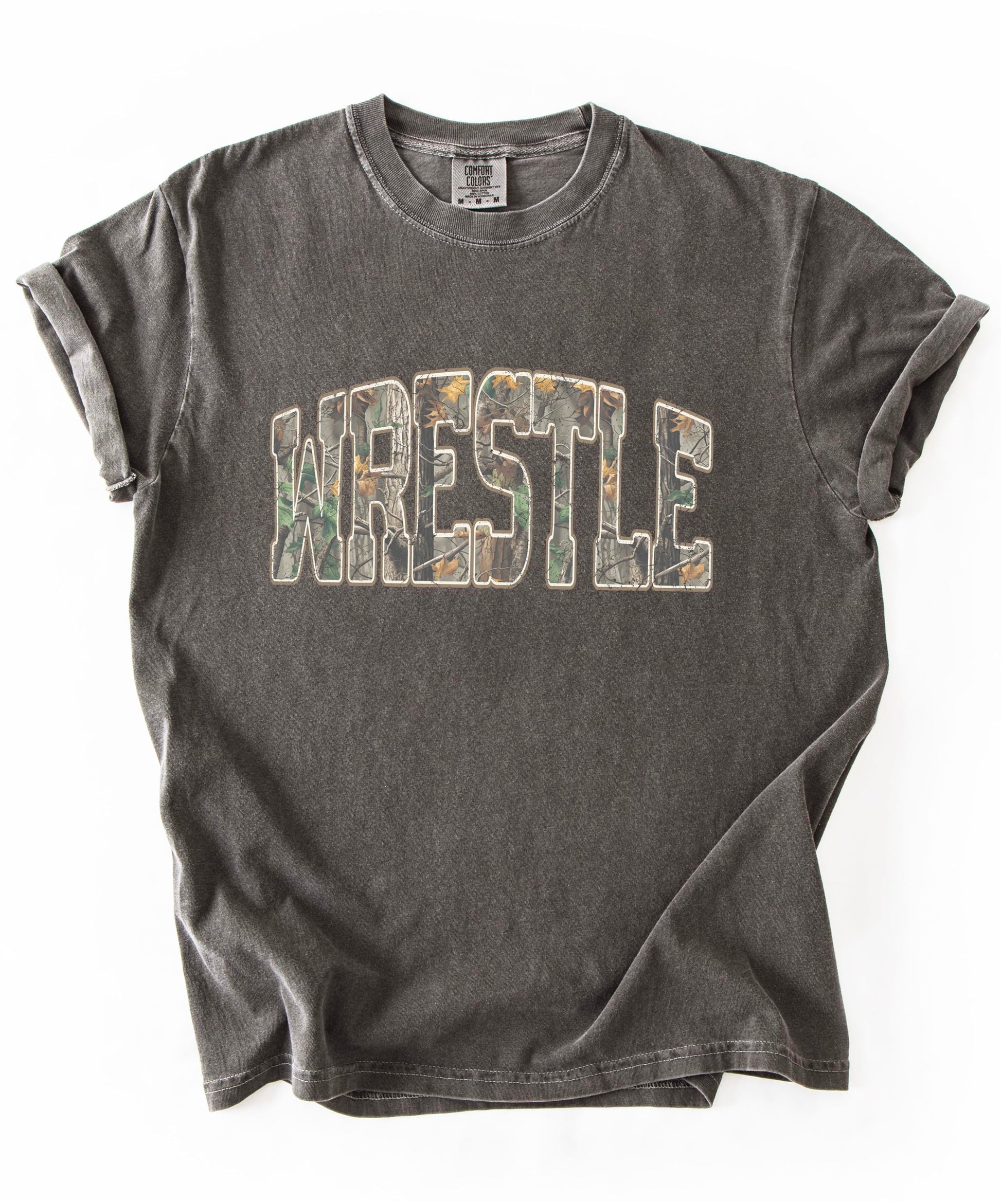 Model wearing camo wrestling graphic tee demonstrating unisex fit