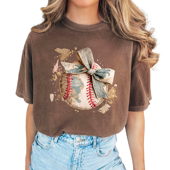 Close-up of baseball camo bow graphic print on women's t-shirt showing vintage distressed style