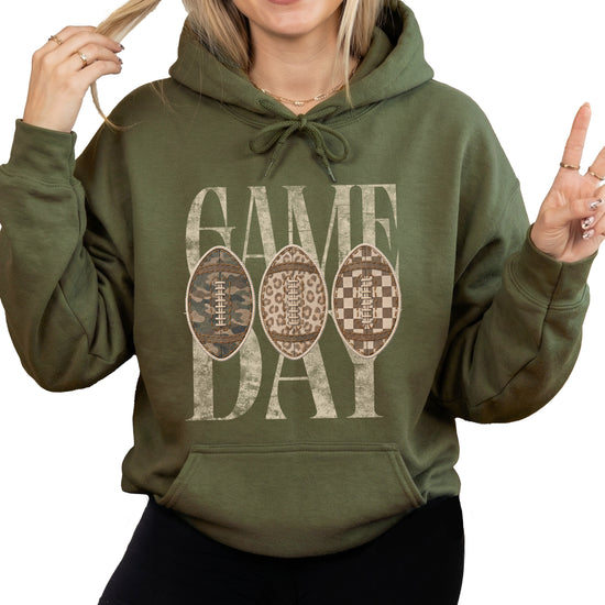 Game Day football hoodie for women in Army Green with camo leopard checkered footballs, front view