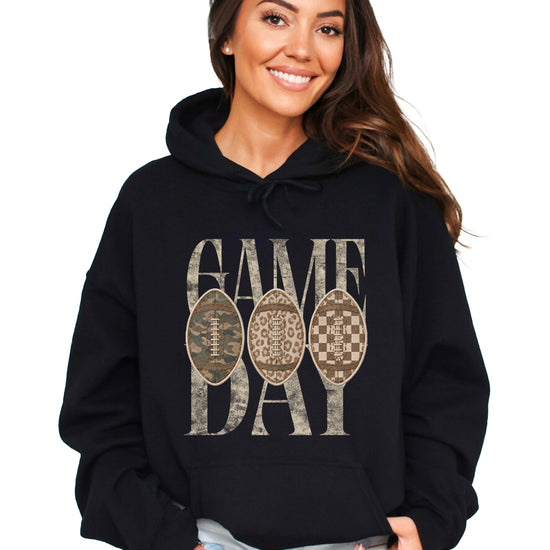 Game Day football hoodie for women in Black with camo leopard checkered footballs, front view