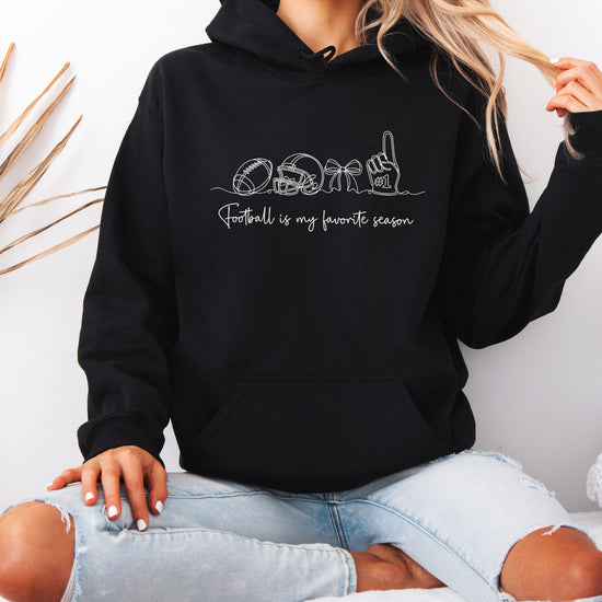 Black coquette football hoodie, close up of graphic