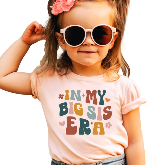 'In My Big Sis Era' girls' graphic tee in Peach, main front view