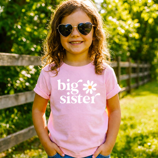 Big Sister Daisy sibling reveal tee for girls in Pink, styled view